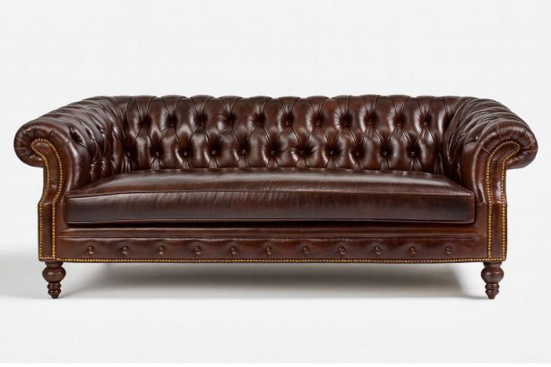 Lux & Borough Orleans style leather tuxedo sofa in warm brown leather featuring deep vertical channel tufting and a low profile base.