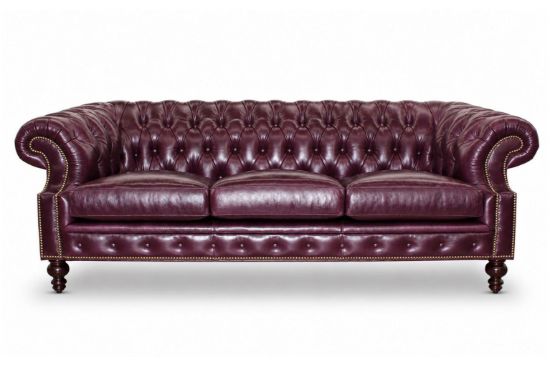 Lux & Borough Orleans style leather tuxedo sofa in warm brown leather featuring deep vertical channel tufting and a low profile base.